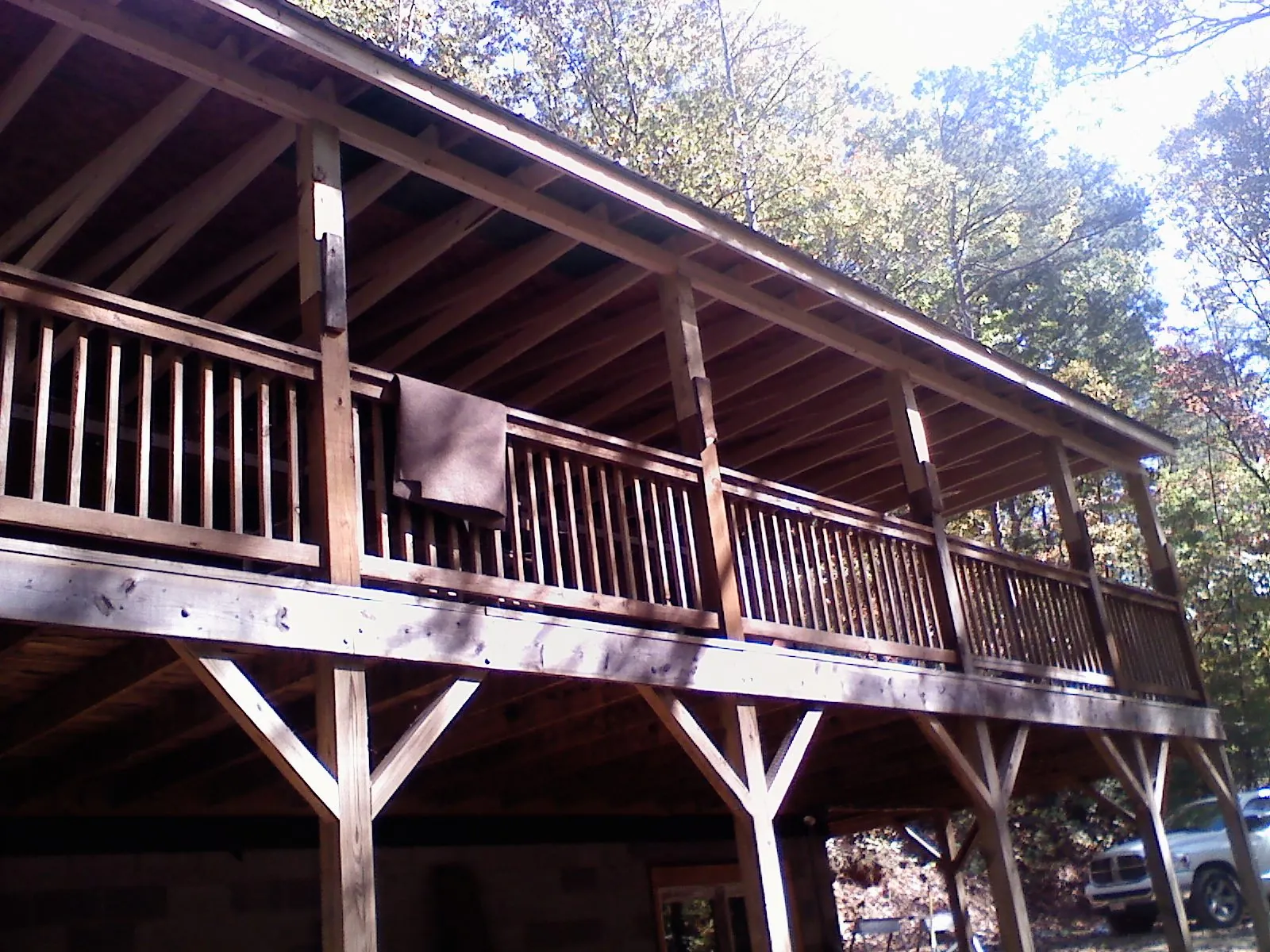 Timber framing under a new elevated porch and deck — Roof Leak Repair in Minburn by Roofing Brothers